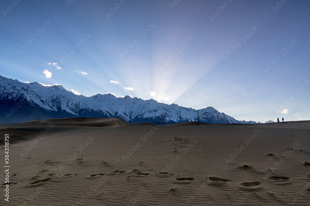 katpana cold desert in skardu ,dunes with snow mountain in background ...