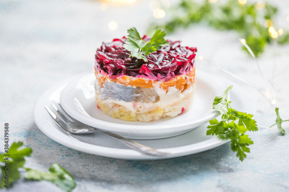 Shuba salad. Russian layered salad with beet, potato, carrot, pickled herring and mayonnaise for Christmas dinner Shuba salad. Russian layered salad with beet, potato, carrot, pickled herring and mayonnaise for Christmas dinner