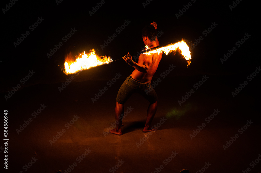 Man doing Fire Show at a beach bar Man doing Fire Show at a beach bar