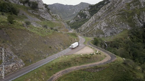 From behind Aerial Truck on a Dangerous High Mountain Road between Rocks and Trees. Going Up. Asturias, Spain.