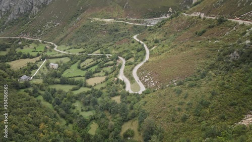 Sinuous a Dangerous High Mountain Road between Rocks and Trees. Asturias, Spain.