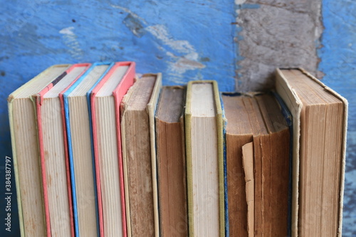 Close-up of old books arranged in the library Old wooden floor as background selective focus and shallow depth of field