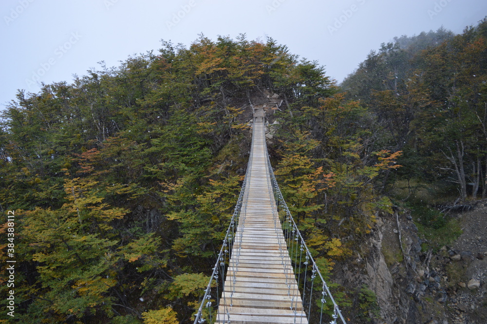 Hiking over glaciers and mountains on the hanging bridges in Torres del Paine National Park in Patagonia, Chile