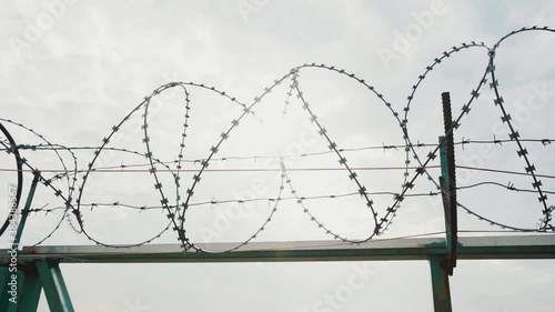 Fence with a barbed wire