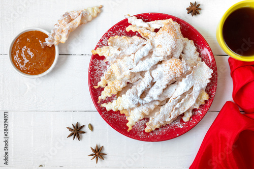 Brushwood - crispy deep fried cookies in powdered sugar with tea and jam. A traditional treat at European festivals. photo