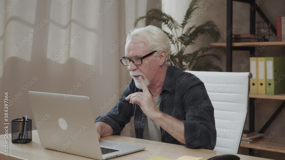Tutor education modern technology concept. Hello hi! Cheerful senior grandpa using netbook telling relatives friends news via video call internet connection Tutor education modern technology concept. Hello hi! Cheerful senior grandpa using netbook telling relatives friends news via video call internet connection