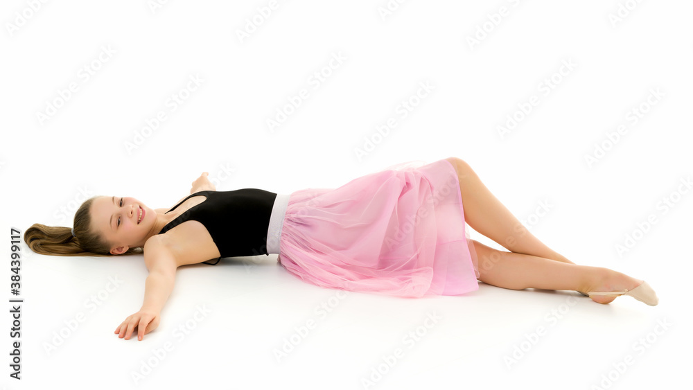 Beautiful Preteen Girl Lying on the Floor Against White Background Beautiful Preteen Girl Lying on the Floor Against White Background