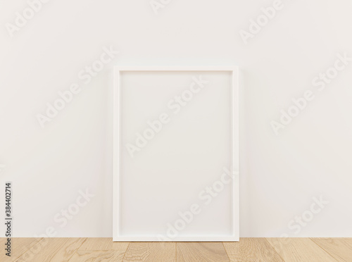Vertical white frame mock up on wooden floor with white wall. 3D illustrations.