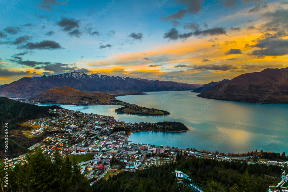 Cityscape sunset of queenstown with lake Wakatipu from the skyline south island new zealand