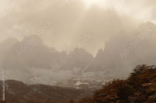 Hiking in the windy and snowy mountains of the Torres del Paine National Park in Patagonia, Chile