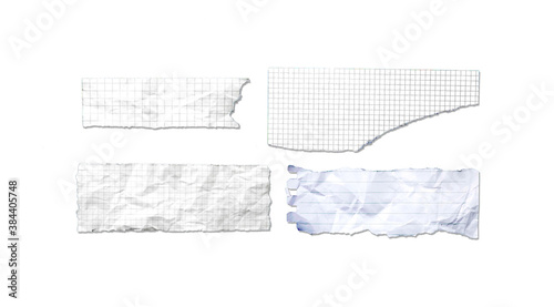 White ripped note, notebook paper stuck with sticky tape on black background.