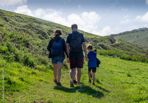  The backview of a family walking along the coastal path at Hartland, North Devon.. © Glenys