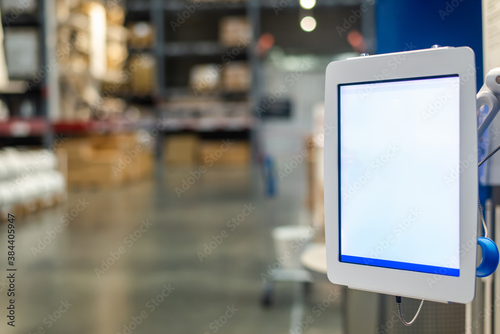Obraz premium tablet pc against manager using digital tablet in warehouse.