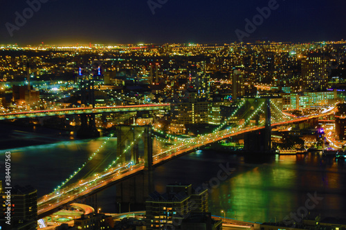 Brooklyn Bridge with lower Manhattan skyline in New York City at night, USA