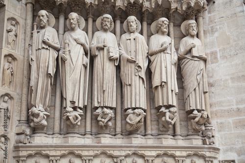 Notre Dame de Paris statues of saints on the cathedral facade.