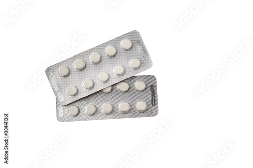 Medical pills or tablets in plastic package isolated on white background.