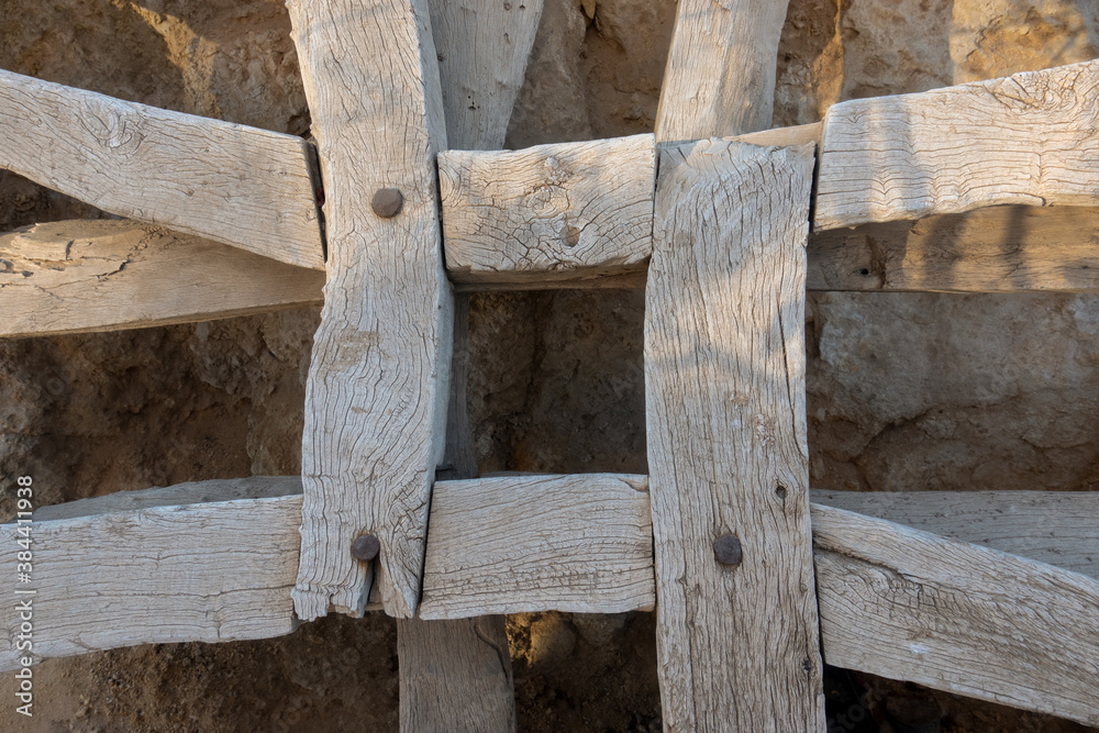 Old wooden planks hammered by nails. Grunge timber background, top view. Brown natural building material, layout pattern. Highly detailed, textured empty surface. Old wooden planks hammered by nails. Grunge timber background, top view. Brown natural building material, layout pattern. Highly detailed, textured empty surface.