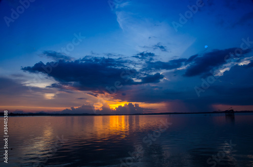 Red purple cloud Sunset lake background Dark red. Cloud Strom