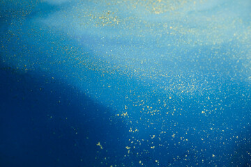 Soft focus Art Abstract paint blots horizontal background. Alcohol ink colors. Marble texture. Violet and gold.