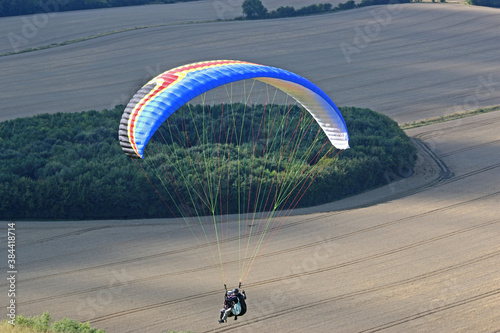 Tandem Paraglider flying at Combe Gibbet, England	