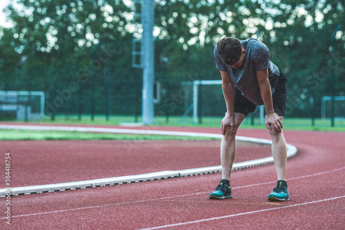 Young Caucasian man taking a break after running