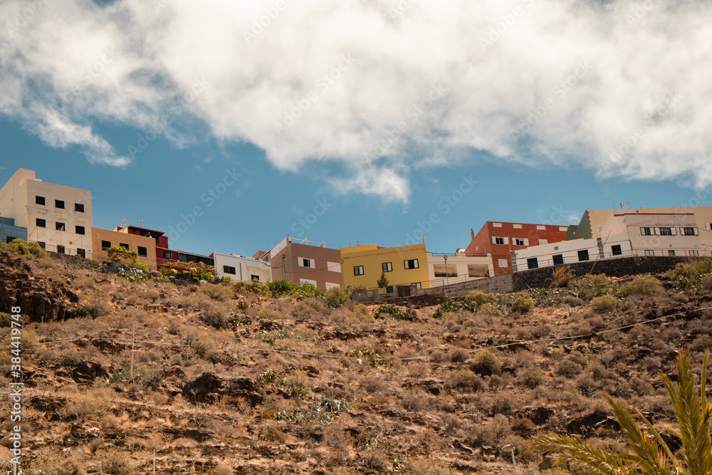 Colorful houses on a hill under the blue sky in San Sebastian, La Gomera, Canary islands
