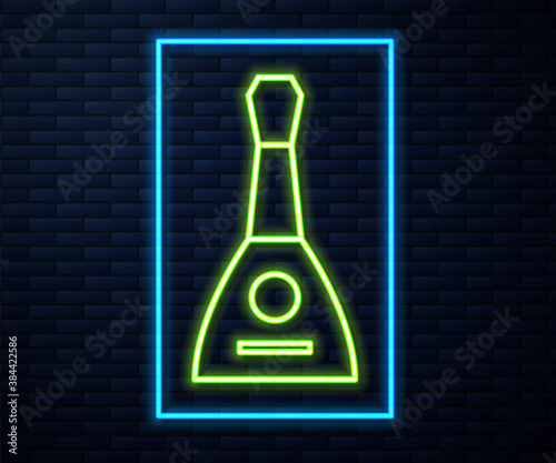 Glowing neon line Musical instrument balalaika icon isolated on brick wall background. Vector.