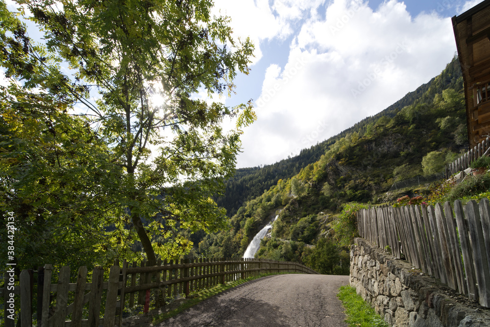 Fototapeta premium Footpath leading to the waterfall near city of Partschins, South Tirol, Italy.