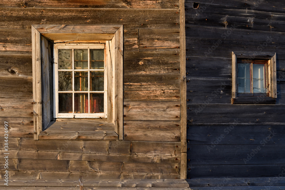 Windows on the wooden wall. Pomor architecture. Karelia, Russia Windows on the wooden wall. Pomor architecture. Karelia, Russia