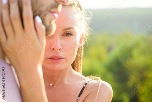 Passionate affectionate man and woman enjoying exciting moment of first kiss.