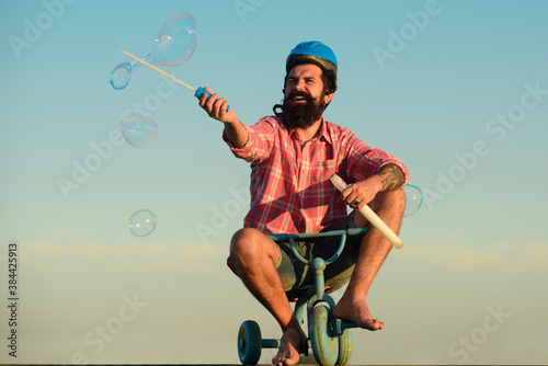 Childhood memory. Funny crazy man riding a bike.