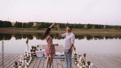 Front frame, couple in love walking on a wooden pond. Bridge arranged with decoration for marriage requests. Marriage proposal concept. Romantic couple. Slow video.