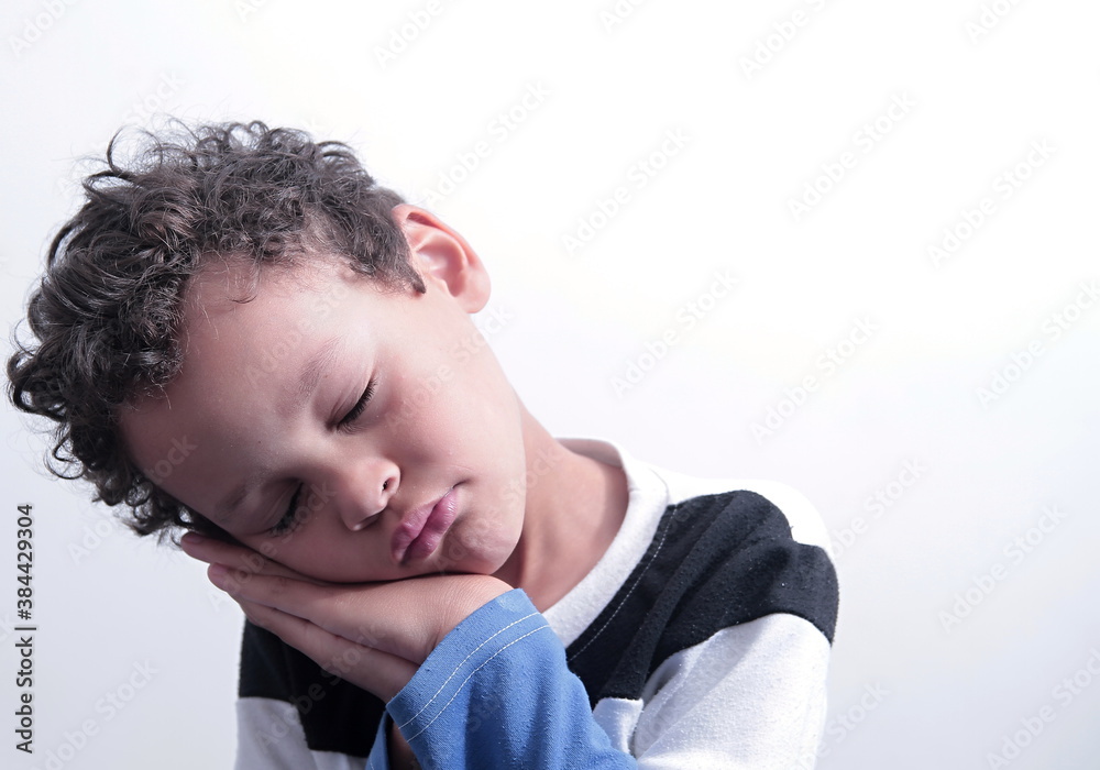 boy praying to God with hands held together with closed eyes on white background stock photo boy praying to God with hands held together with closed eyes on white background stock photo