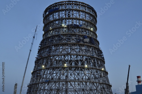 Construction of a large metal cooling tower. Metal carcass. Metal cooling tower.