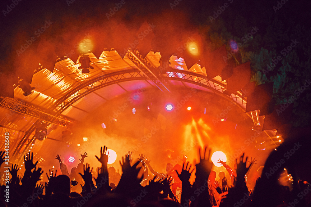 Abstract blur atmosphere: happy people enjoying outdoor music festival