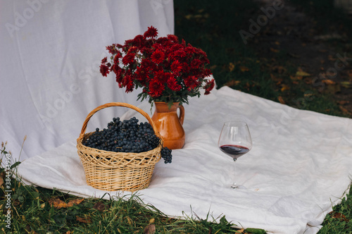 basket with grapes and flowers