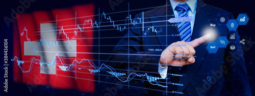 Businessman touching data analytics process system with KPI financial charts, dashboard of stock and marketing on virtual interface. With Switzerland flag in background.