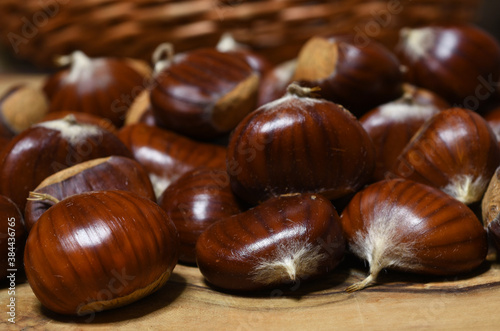 closeup of chestnuts on wood.