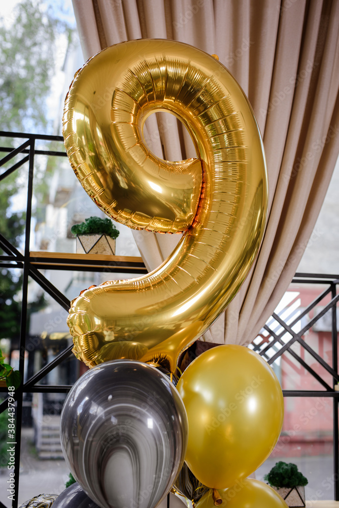 Number 9 of golden helium balloon in decoration
