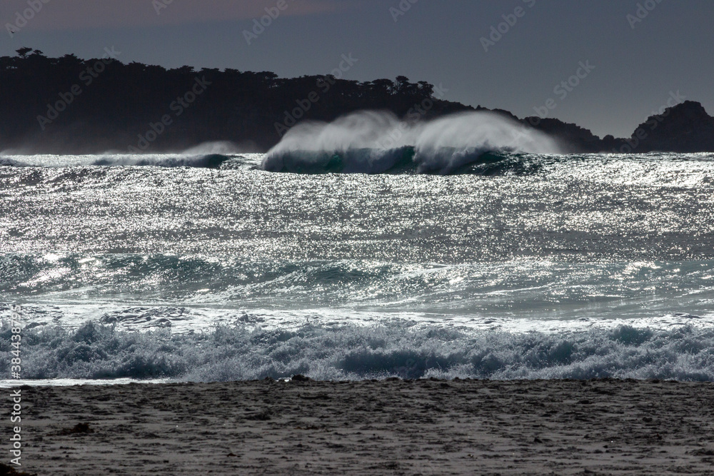Waves breaking on the beach near the town of Carmel on the pacific coast  of California