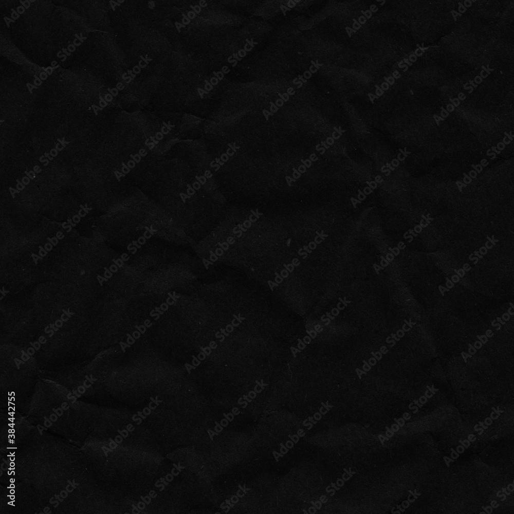 Fototapeta premium Black vintage and old looking crumpled paper background. Retro cardboard texture. Grunge paper for drawing. Ancient book page. Present wrapping.