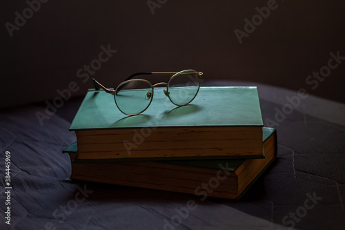 old books and glasses