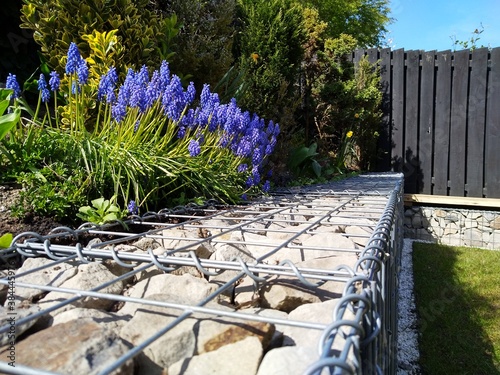 gabion wall close up, diy retaining wall with gabion stones in baskets