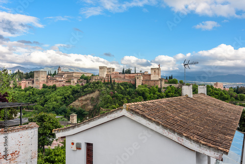 flawor of andalusia
view of the alhambra from the saint nicolas sightseein during a cloudy day at sunset granada, spain photo