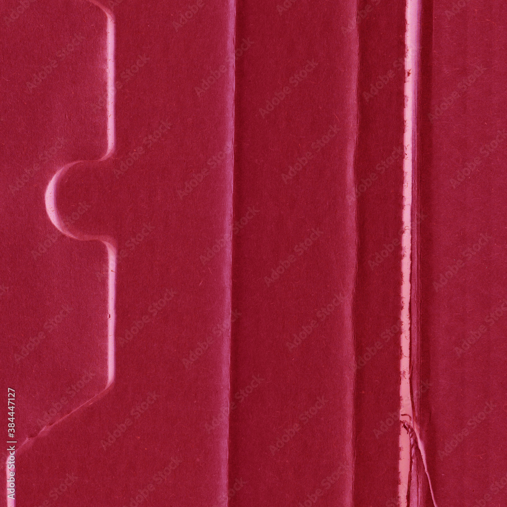 Fototapeta premium A red vintage rough sheet of carton. Recycled environmentally friendly cardboard paper texture. Simple and bright minimalist papercraft background.
