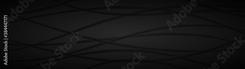 Abstract dark background of wavy intertwining lines in black and gray colors
