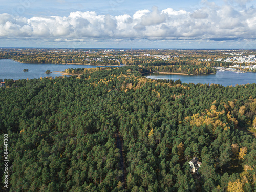 The coastline of the Gulf of Finland and in the horizon you can see Helsinki, a sunny autumn day. Scandinavian nature and landscape. Aerial view from drone