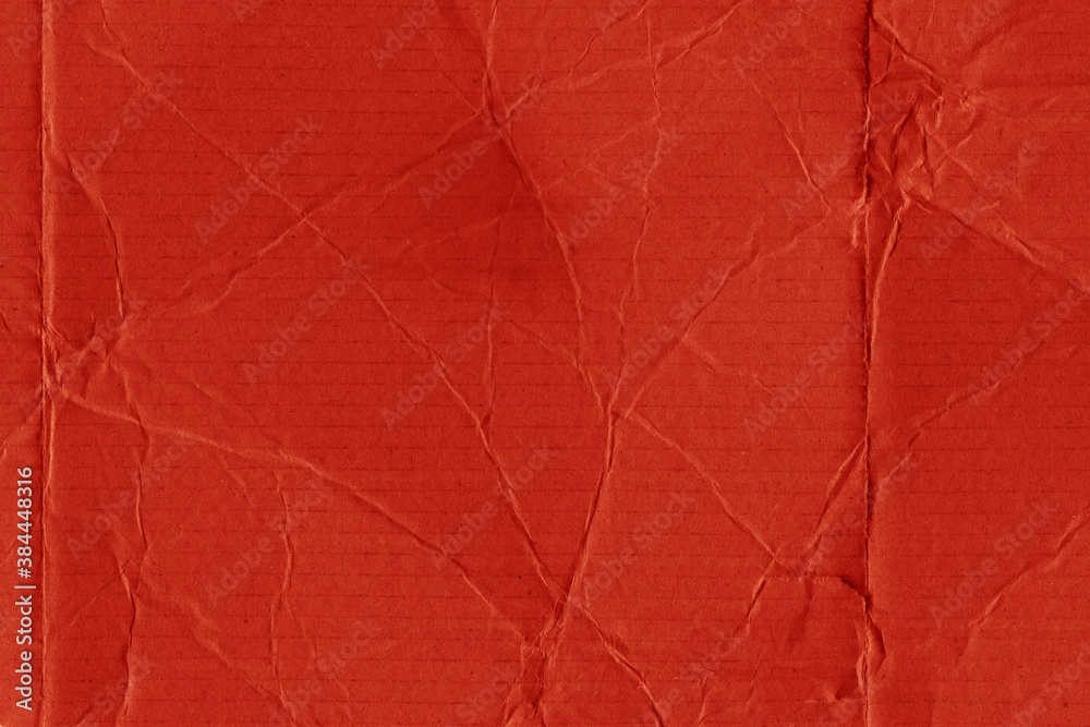 Obraz premium A red vintage rough sheet of carton. Recycled environmentally friendly cardboard paper texture. Simple and bright minimalist papercraft background.