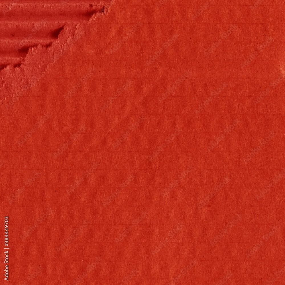 Fototapeta premium A red vintage rough sheet of carton. Recycled environmentally friendly cardboard paper texture. Simple and bright minimalist papercraft background. 