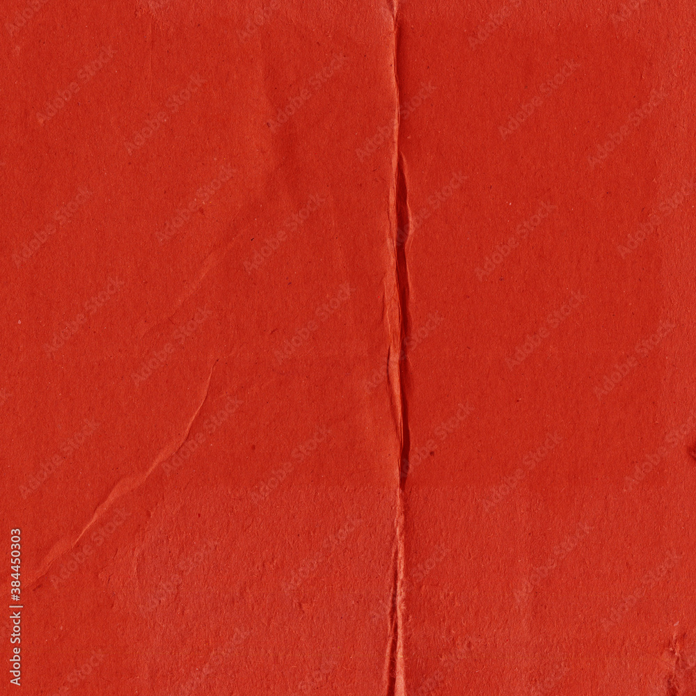 Fototapeta premium A red vintage rough sheet of carton. Recycled environmentally friendly cardboard paper texture. Simple and bright minimalist papercraft background. 